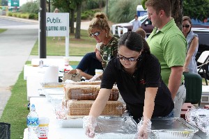 In July, chapter members enjoy barbeque and baseball during a Young AFCEAN recruitment event.